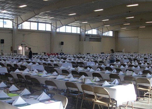 A large amount of tables and chairs set up in the Agriculture Building for a banquet