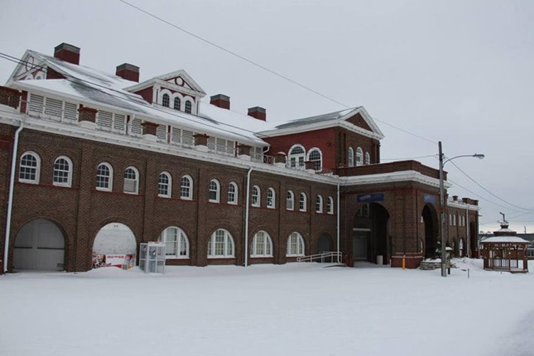 The exterior of the Coliseum covered in snow