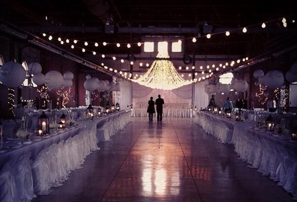 The interior of the Commercial Building decorated for a wedding at night