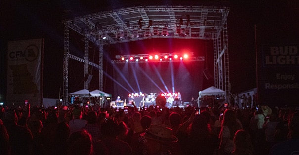 A nighttime shot of a concert on the stage at the Grandstand