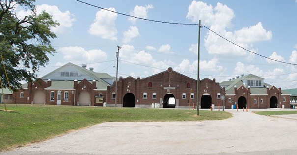 A wide angle view of the exterior of the horse barns