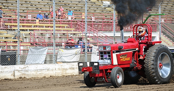 An individual participating in a hot rod tractor pull
