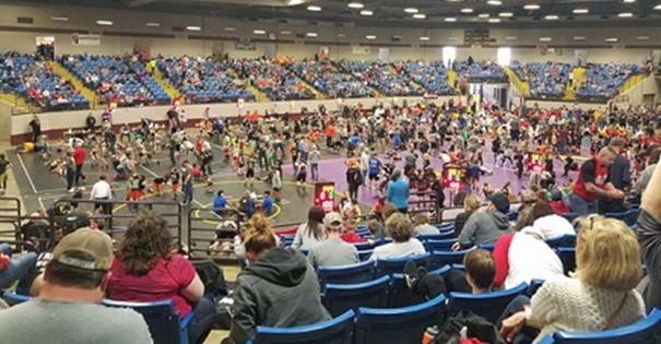 People watching a wrestling event at the Missouri State Fairgrounds
