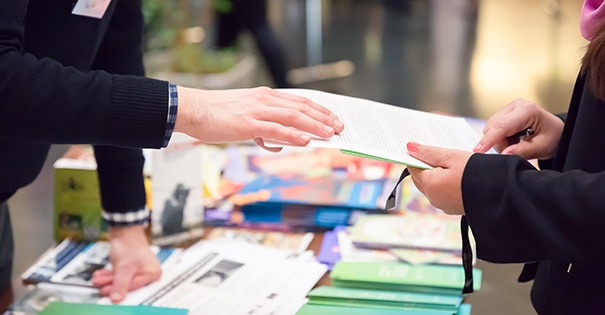 Two people discussing over a piece of paper