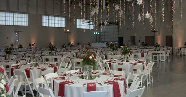Folding tables and chairs set up for a wedding in the assembly hall