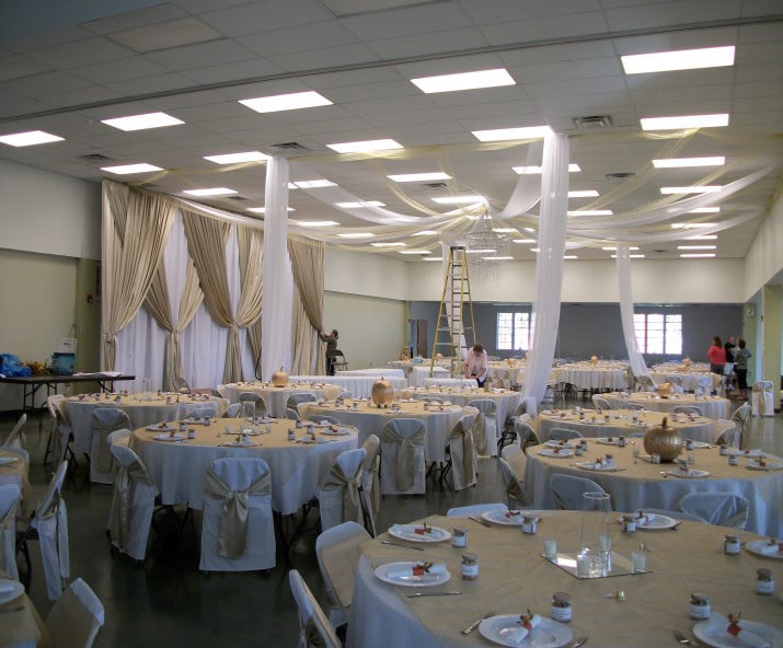 Individuals decorating for a wedding in the MEC building