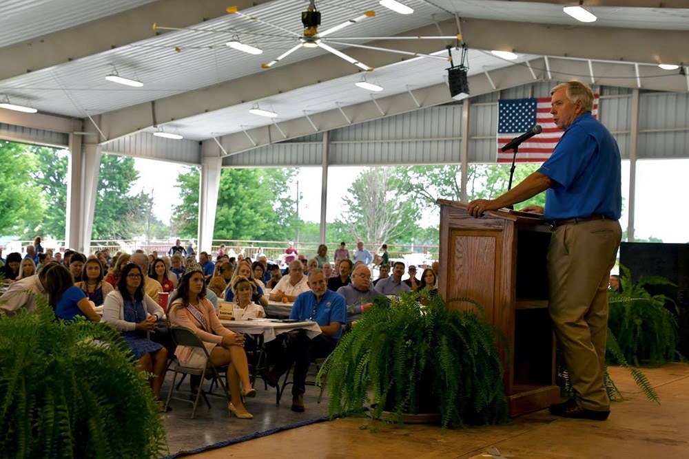 Governor Mike Parsons speaking at an event in the Nucor Director's Pavilion