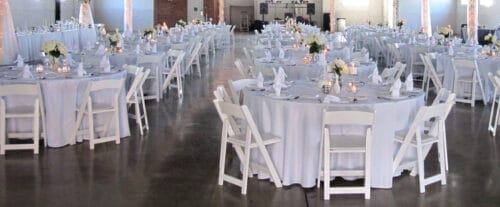 Reservable space set up as a wedding reception area with decorations and tables