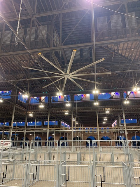 Large overhead fans in the inside of the Swine Pavilion